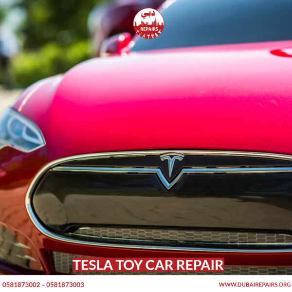 Tesla toy car repair technician in Dubai workshop