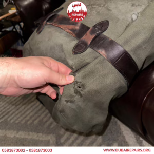 Duffel bag with damaged zipper being repaired in Dubai