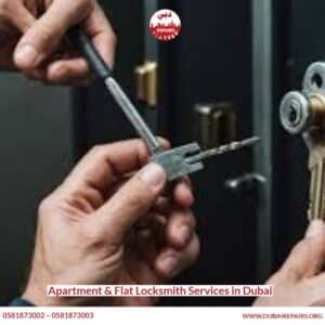 Locksmith repairing an apartment door lock in Dubai
