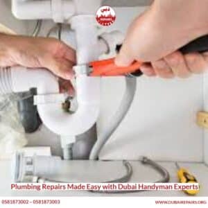 Plumber replacing a water heater element in a Dubai apartment