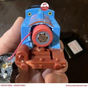 Water damaged electronic toy being repaired in Dubai